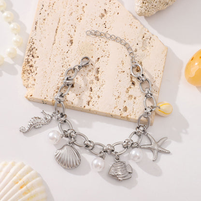 Seashell Charm Bracelet for Women by Ginger Lyne Gold Plated Stainless Steel Pearls Starfish and Shells