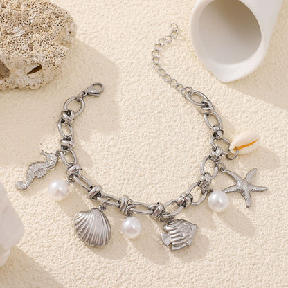 SeashellCharmBraceletforWomenbyGingerLyneGoldPlatedStainlessSteelPearlsStarfishandShells_Silver-4