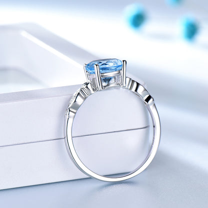 BlueTopazEngagementforWomenRingSterlingSilverGingerLyneCollection_Blue-4