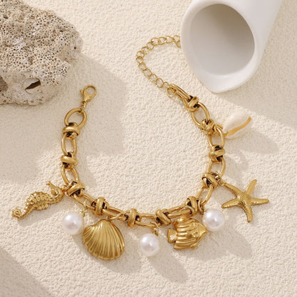Seashell Charm Bracelet for Women by Ginger Lyne Gold Plated Stainless Steel Pearls Starfish and Shells - Gold