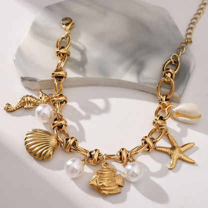 Seashell Charm Bracelet for Women by Ginger Lyne Gold Plated Stainless Steel Pearls Starfish and Shells - Gold