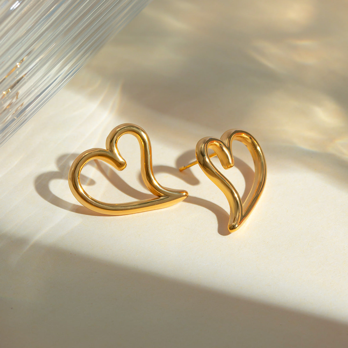 CurvedHeartEarringsforWomenGoldStainlessSteelChunkyStudsLightweightGingerLyne_Gold-3